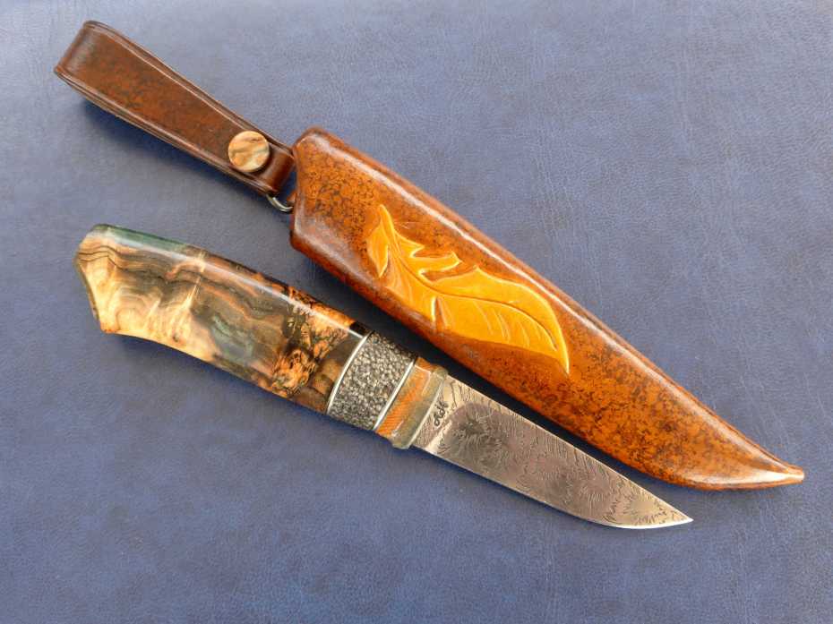 Damascus bar by Mattias Styrefors, grinded by Anders Hedlund. handle in mammoth tusk, buffalo antler and dyed and stabilized aspen burl